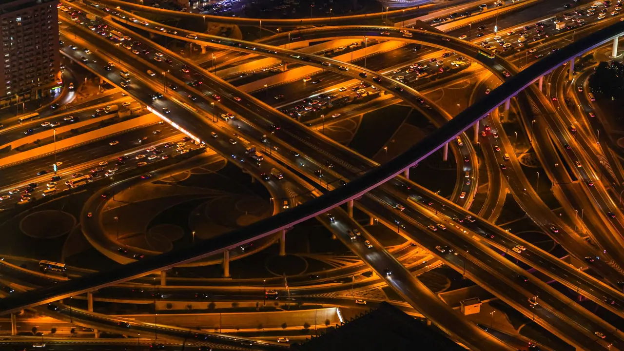 Dubai, UAE at night: traffic on a multi-level highway interchange